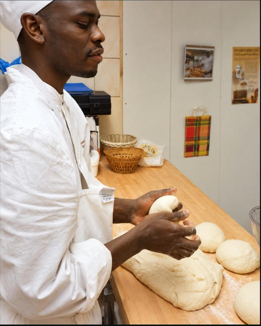 Sébastien G., founder of The Golden Crust, working in the bakery